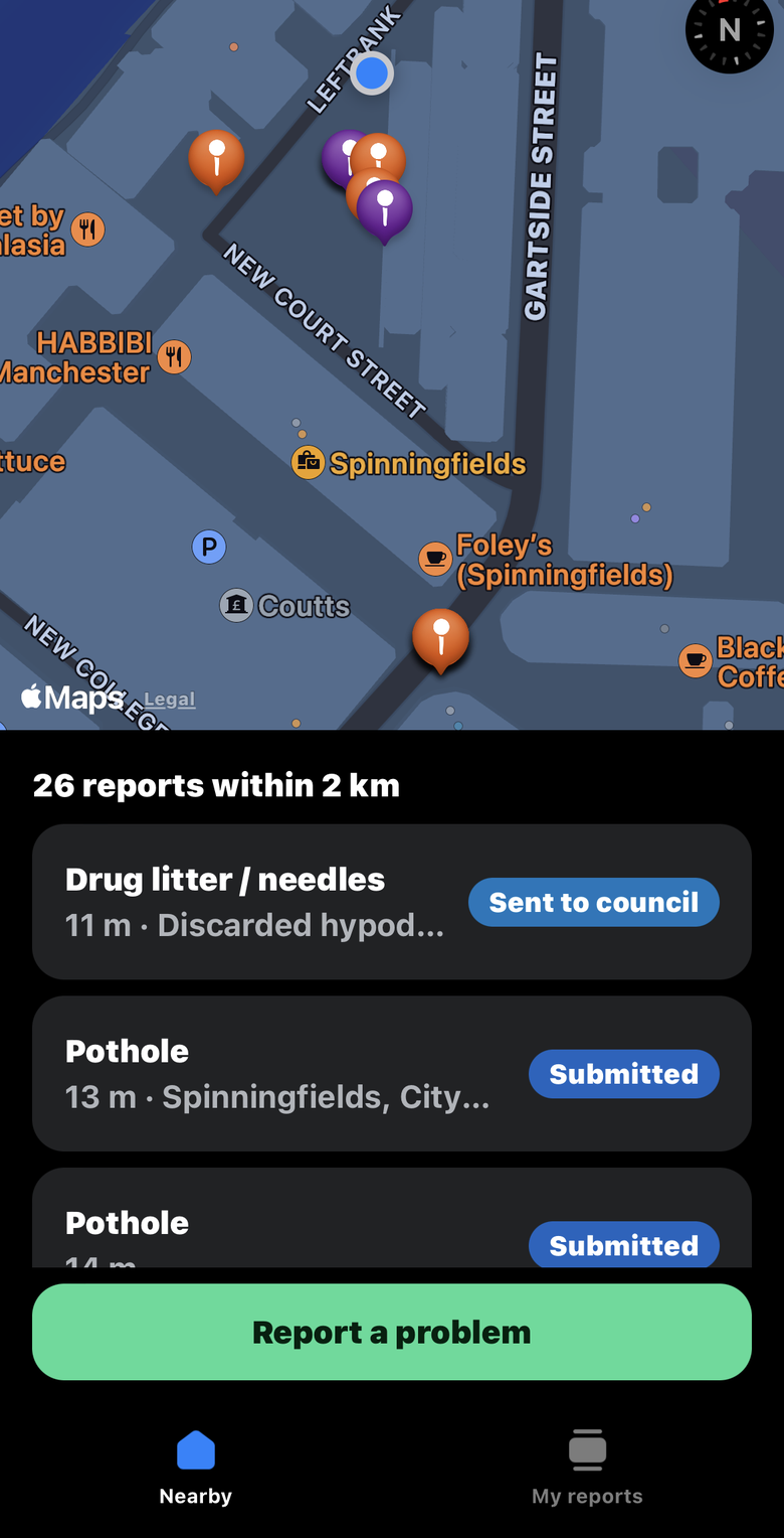 Map of nearby reports in Spinningfields, Manchester, with a list of reports and their status